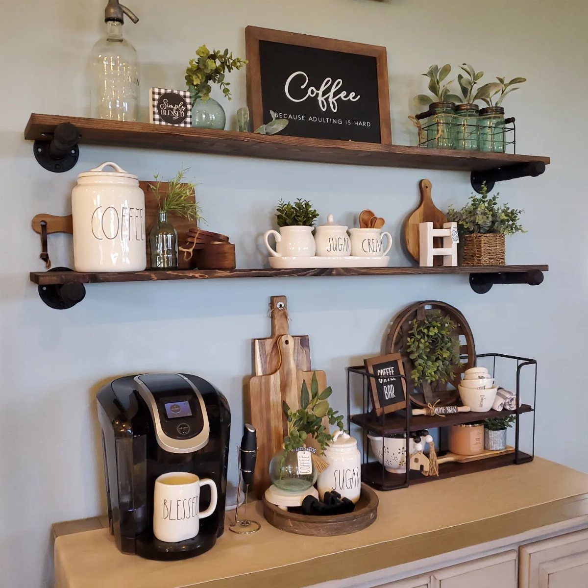 17 Antique Coffee Decor Ideas for Your Kitchen or Nook 5 Rustic wall-mounted coffee station with dark wood shelves, coffee maker, and farmhouse decor.