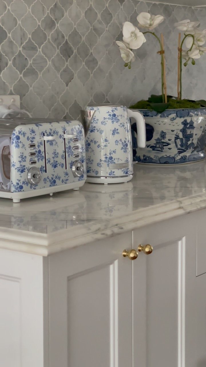 Blue Kitchen Appliances: 28 Ideas from Ranges to Kettles 18 Blue floral patterned toaster and kettle on a white marble kitchen countertop.