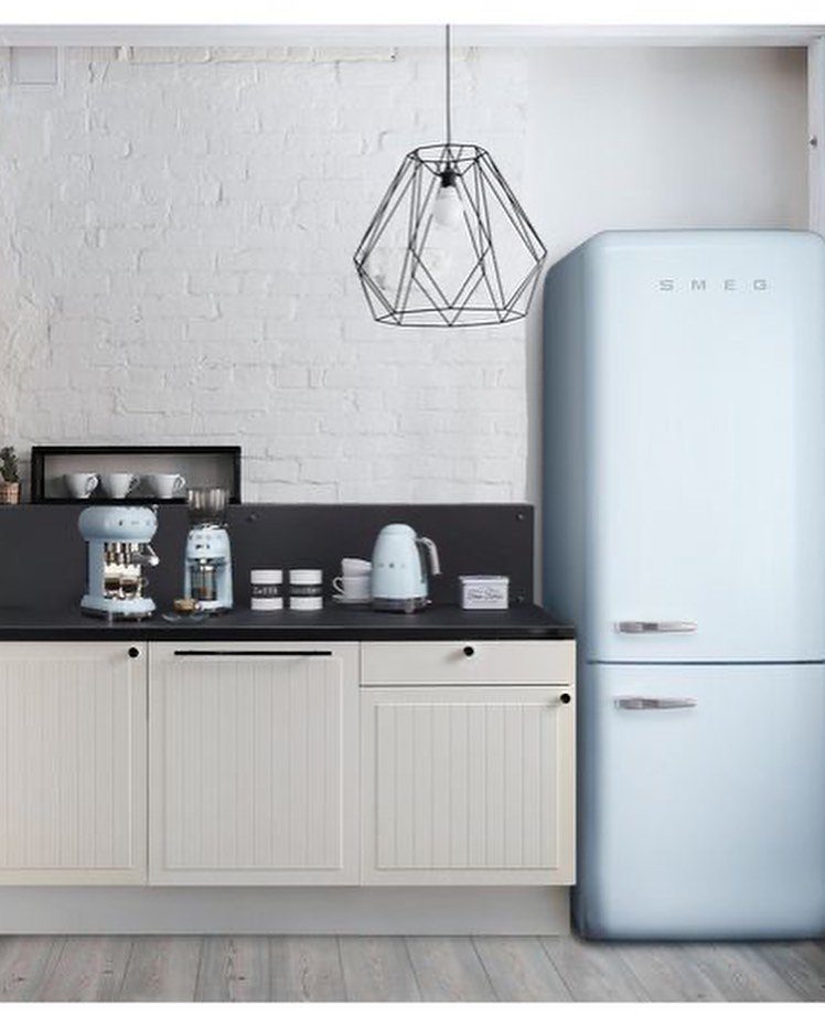 Blue Kitchen Appliances: 28 Ideas from Ranges to Kettles 29 Light blue refrigerator, espresso machine, and kettle in a white kitchen with brick walls.
