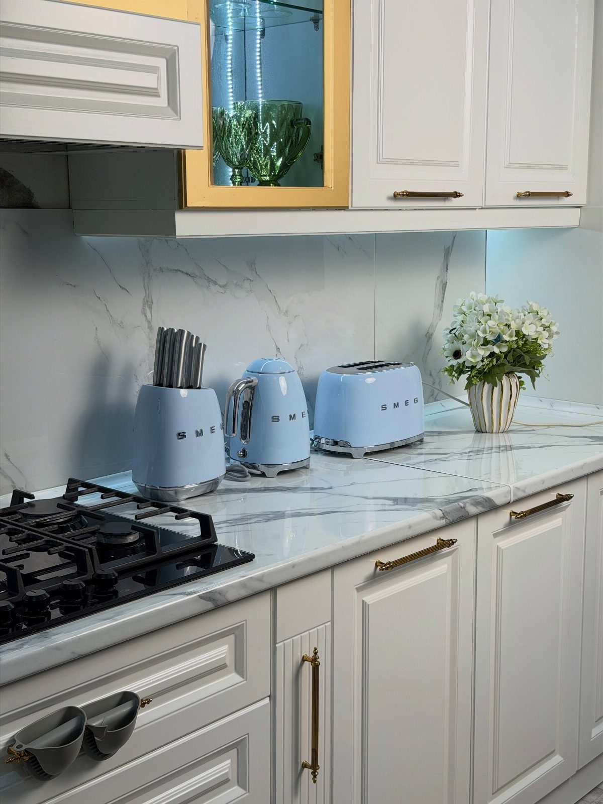 Blue Kitchen Appliances: 28 Ideas from Ranges to Kettles 16 Light blue toaster, kettle, and utensil holder on a white marble kitchen counter.