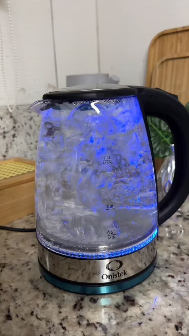 Blue Kitchen Appliances: 28 Ideas from Ranges to Kettles 21 Glass electric kettle with blue LED lighting on a granite kitchen counter