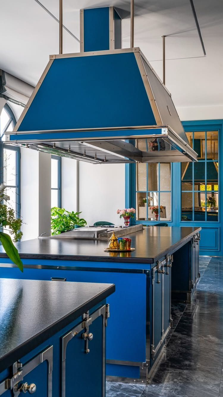 Blue Kitchen Appliances: 28 Ideas from Ranges to Kettles 5 Large blue range hood and matching blue kitchen cabinets with black countertops.