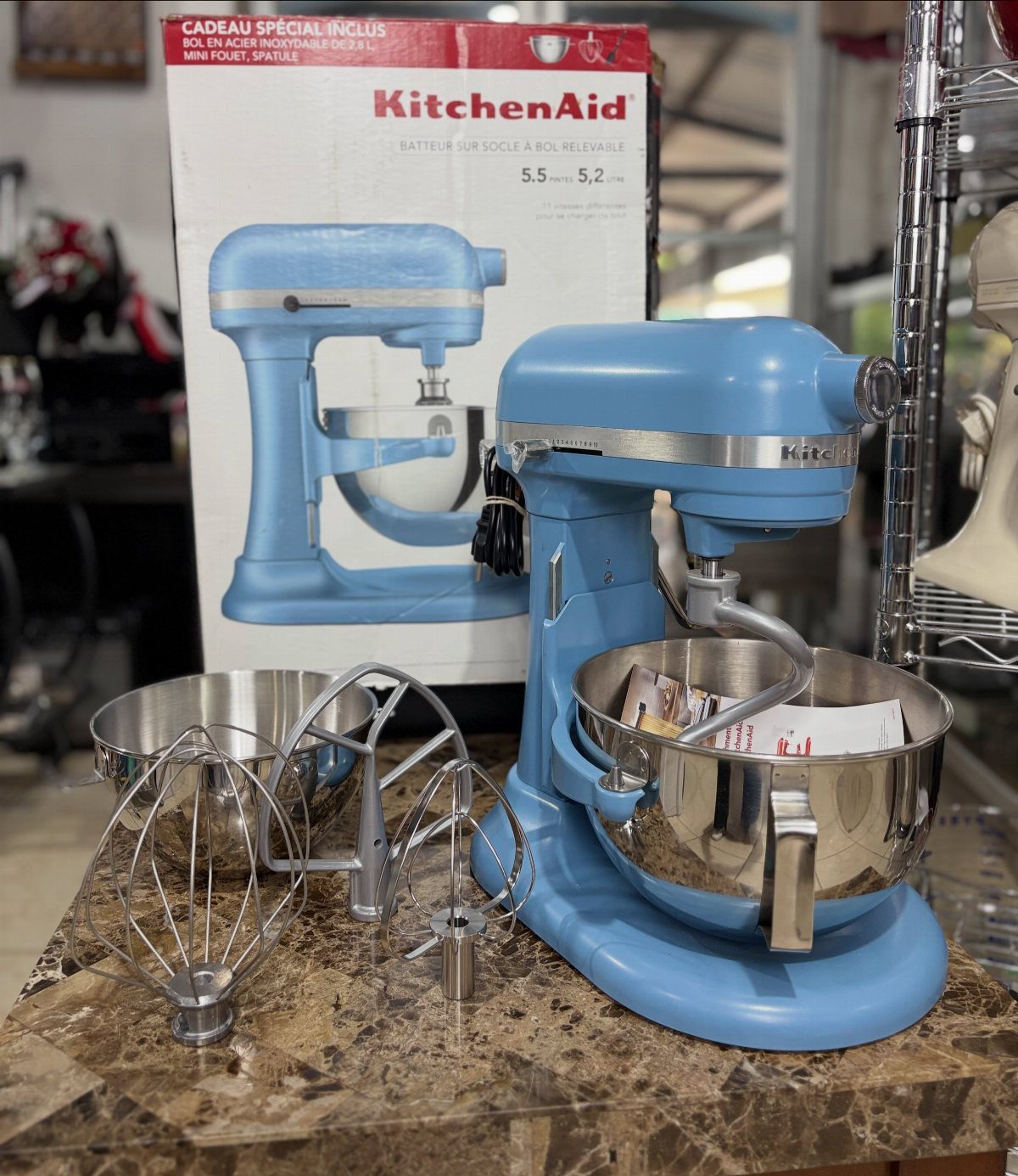 Blue Kitchen Appliances: 28 Ideas from Ranges to Kettles 28 Light blue stand mixer with stainless steel bowl and attachments on marble countertop
