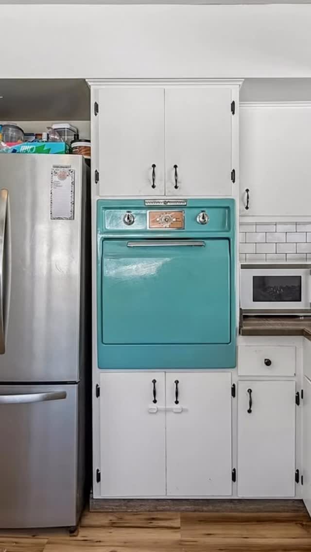 Blue Kitchen Appliances: 28 Ideas from Ranges to Kettles 4 Turquoise blue wall oven built into white kitchen cabinets next to a refrigerator.