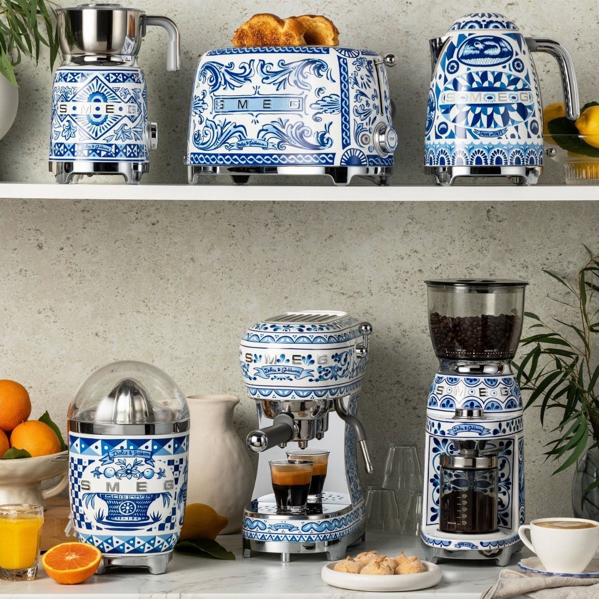 Blue Kitchen Appliances: 28 Ideas from Ranges to Kettles 26 Blue and white patterned Smeg kitchen appliances arranged on a white countertop.