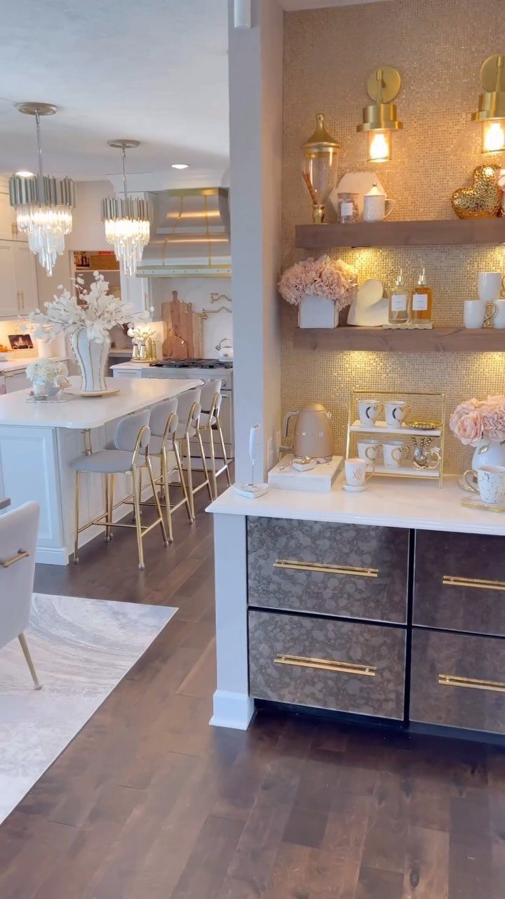Coffee station with white countertop, dark grey drawers, and wooden floating shelves.