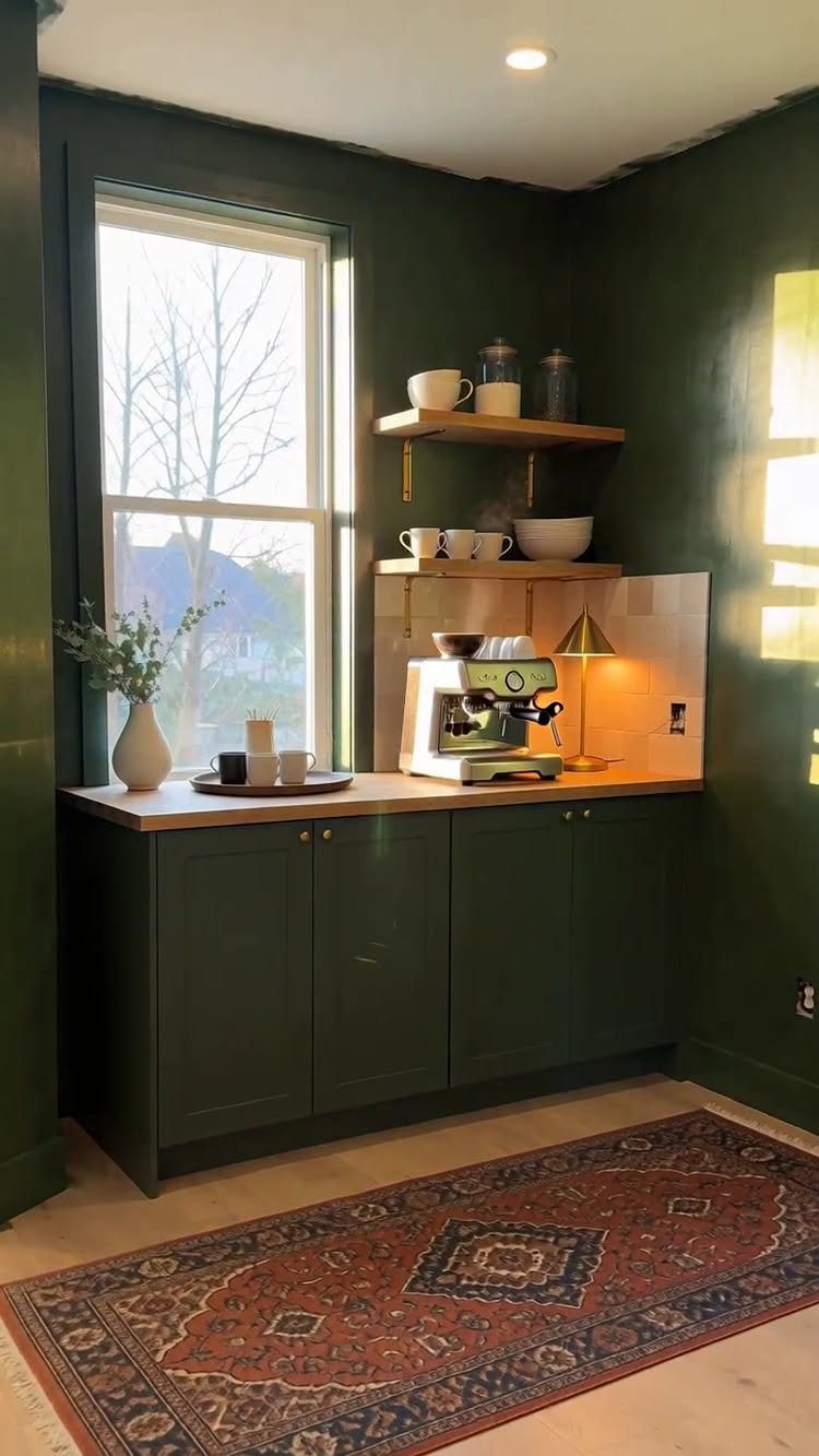 16 Home Coffee Stand Ideas to Fit Any Space 9 Green built-in coffee station with espresso machine and floating shelves by a window.