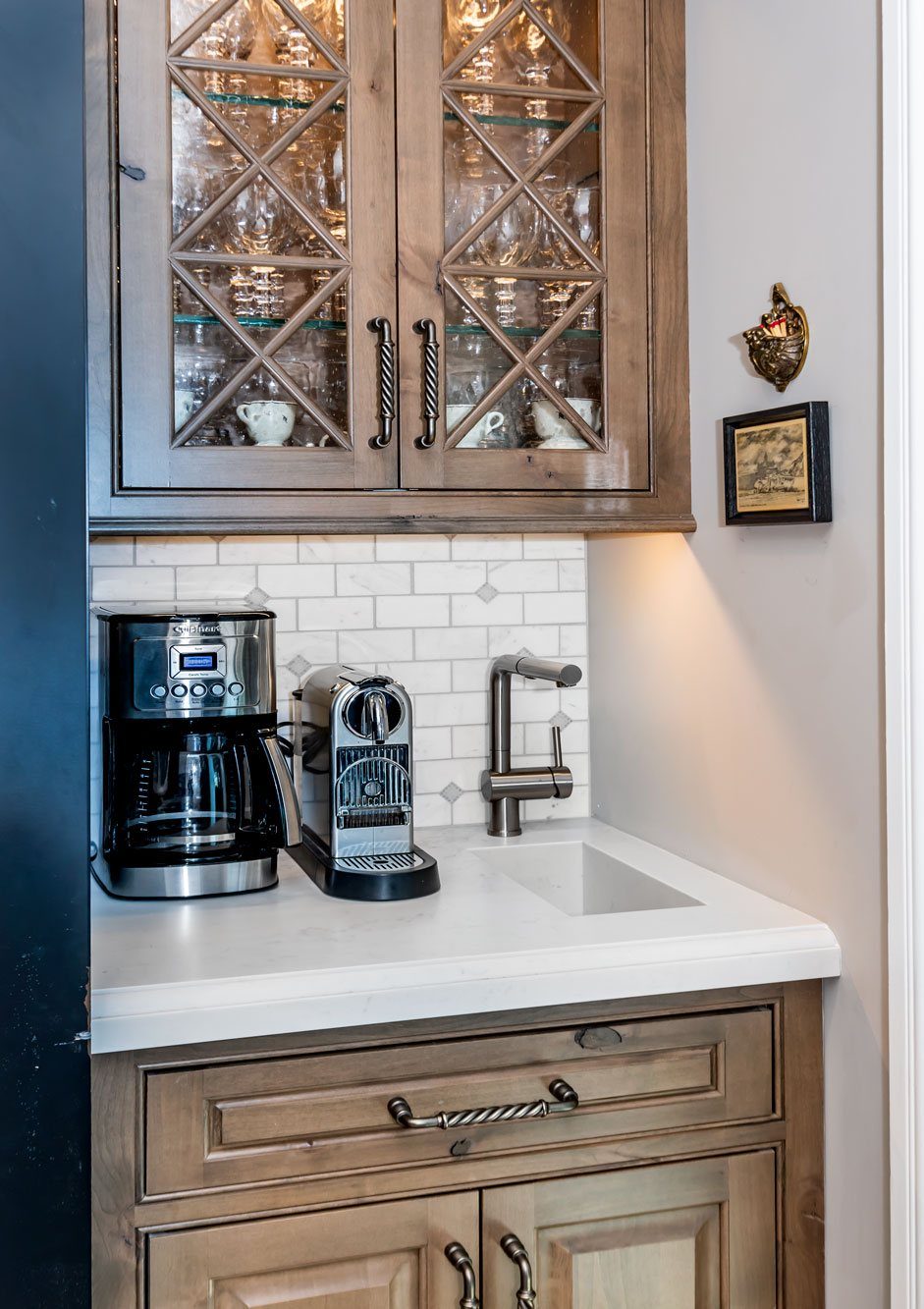 16 Home Coffee Stand Ideas to Fit Any Space 4 Coffee station with two machines and a small integrated sink on a white countertop.