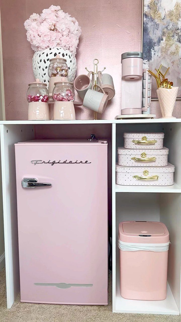 16 Home Coffee Stand Ideas to Fit Any Space 15 Pink beverage station with a small pink refrigerator and matching pink accessories.