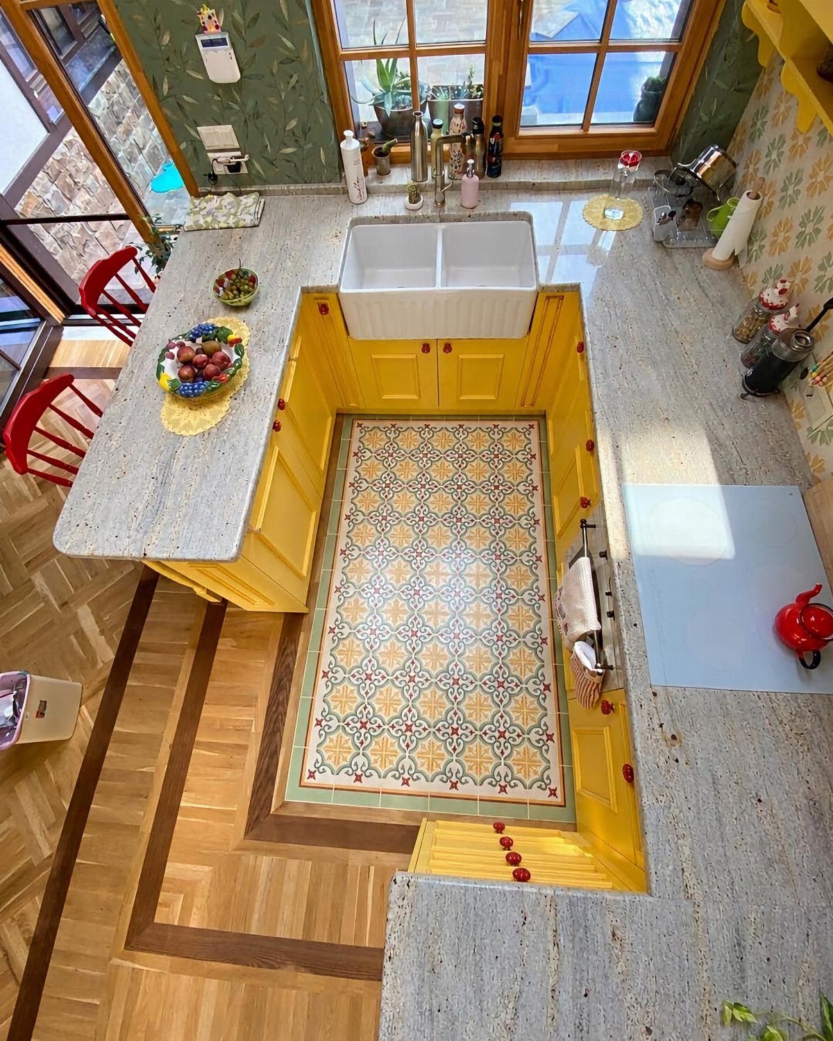 20 Home Kitchen Decor Ideas to Refresh Your Space 15 Patterned decorative floor tiles embedded in a light wood parquet kitchen floor.