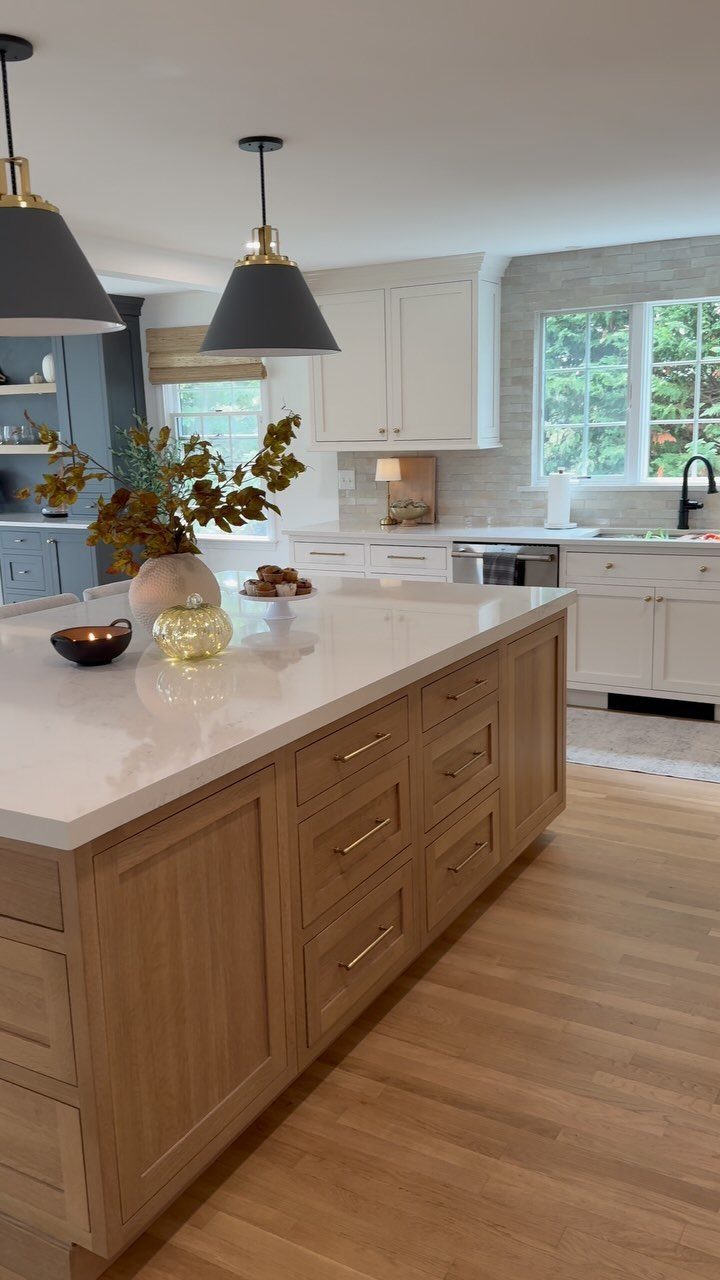 20 Home Kitchen Decor Ideas to Refresh Your Space 19 Kitchen island with light oak wood cabinetry and a white marble countertop.