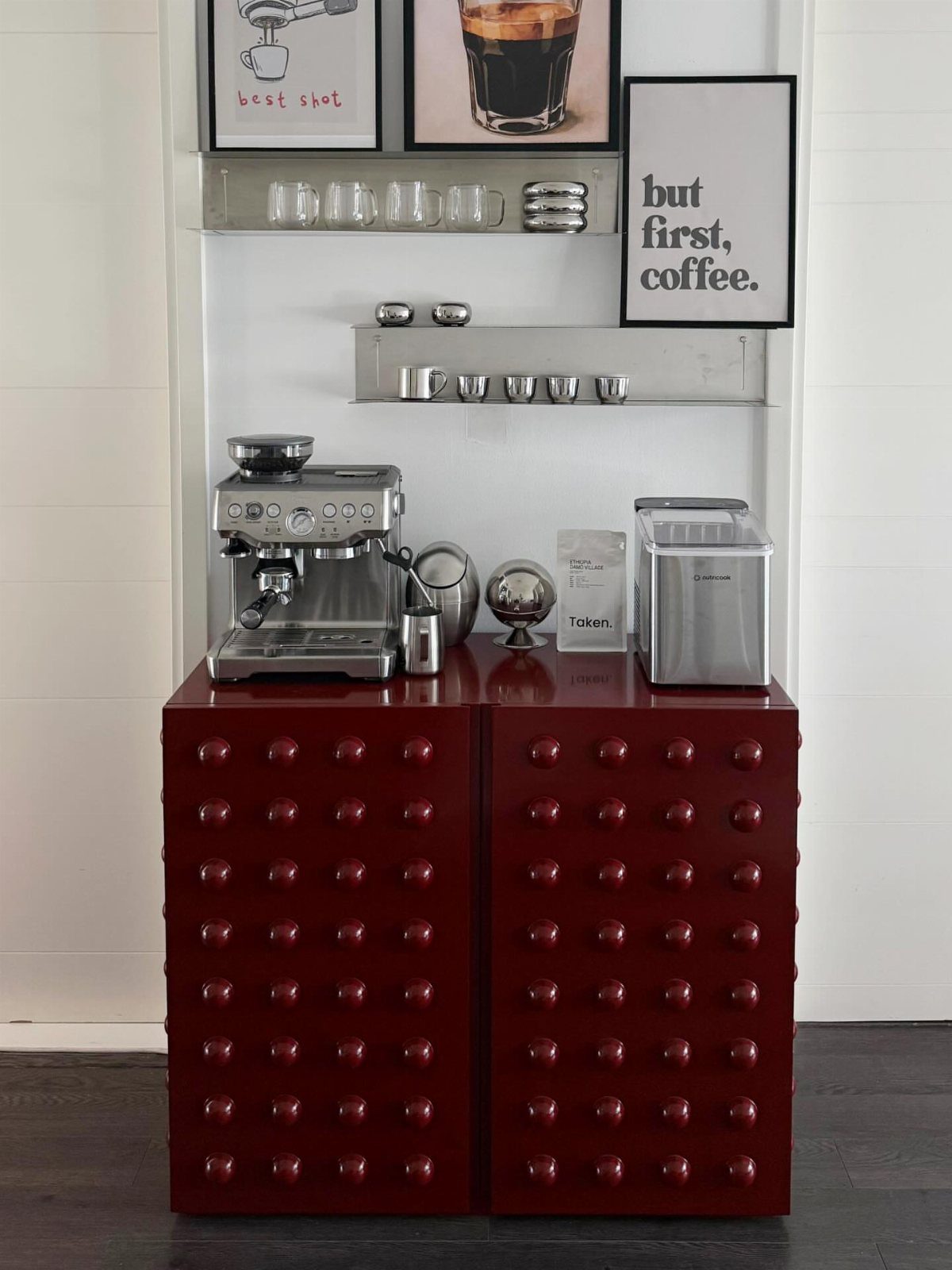 Red IKEA metal cabinets used as a coffee station with an espresso machine.