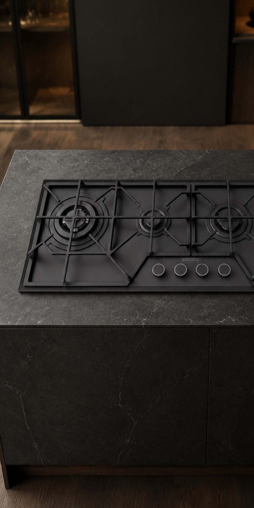 17 Kitchen Stoves Ideas for Every Style and Cooking Need 10 Black gas cooktop with four burners integrated into a dark gray marble countertop.