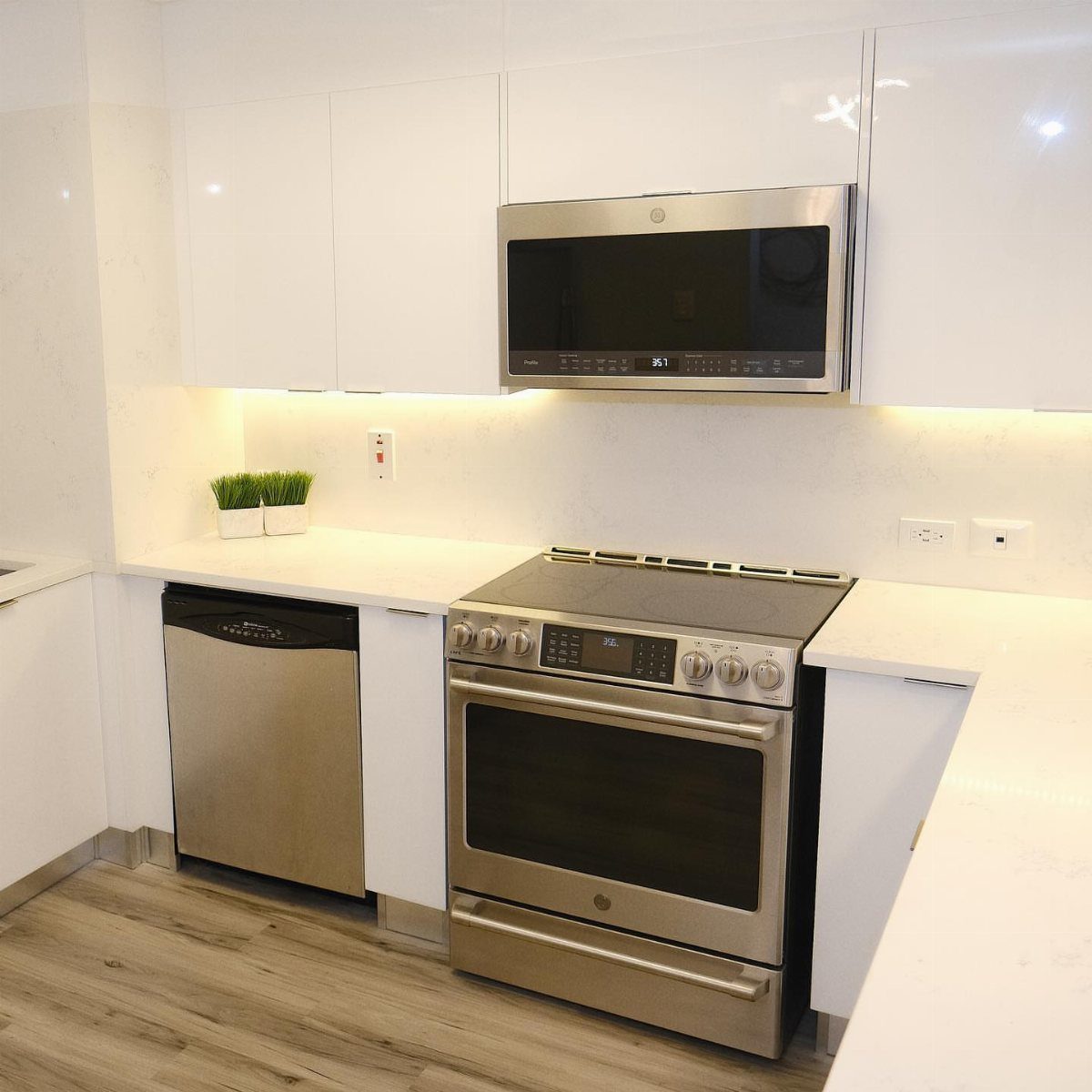 17 Kitchen Stoves Ideas for Every Style and Cooking Need 11 Stainless steel slide-in electric range installed between white kitchen cabinets and white countertops.