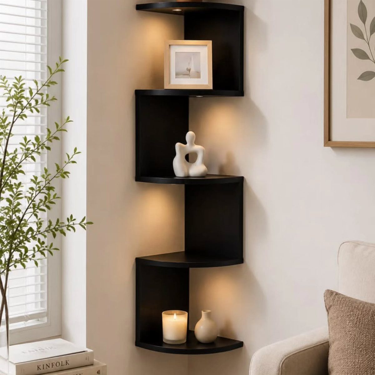Black floating corner shelves with warm LED lighting holding decorative home accessories.