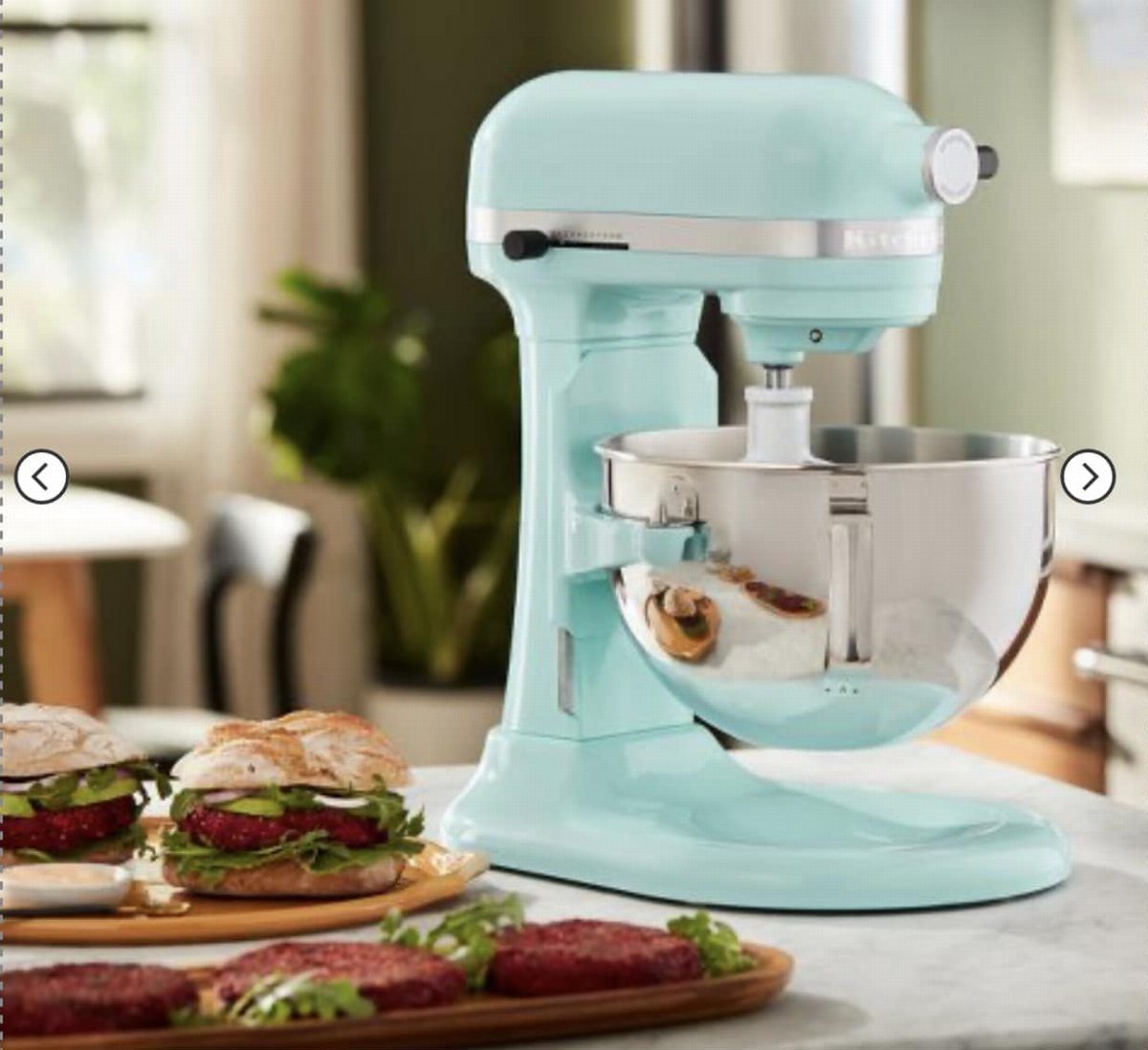 Light blue matte stand mixer with a stainless steel bowl and beet burgers.