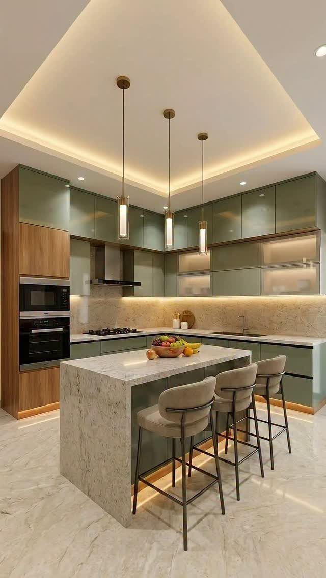 White marble waterfall edge kitchen island with three beige upholstered bar stools.