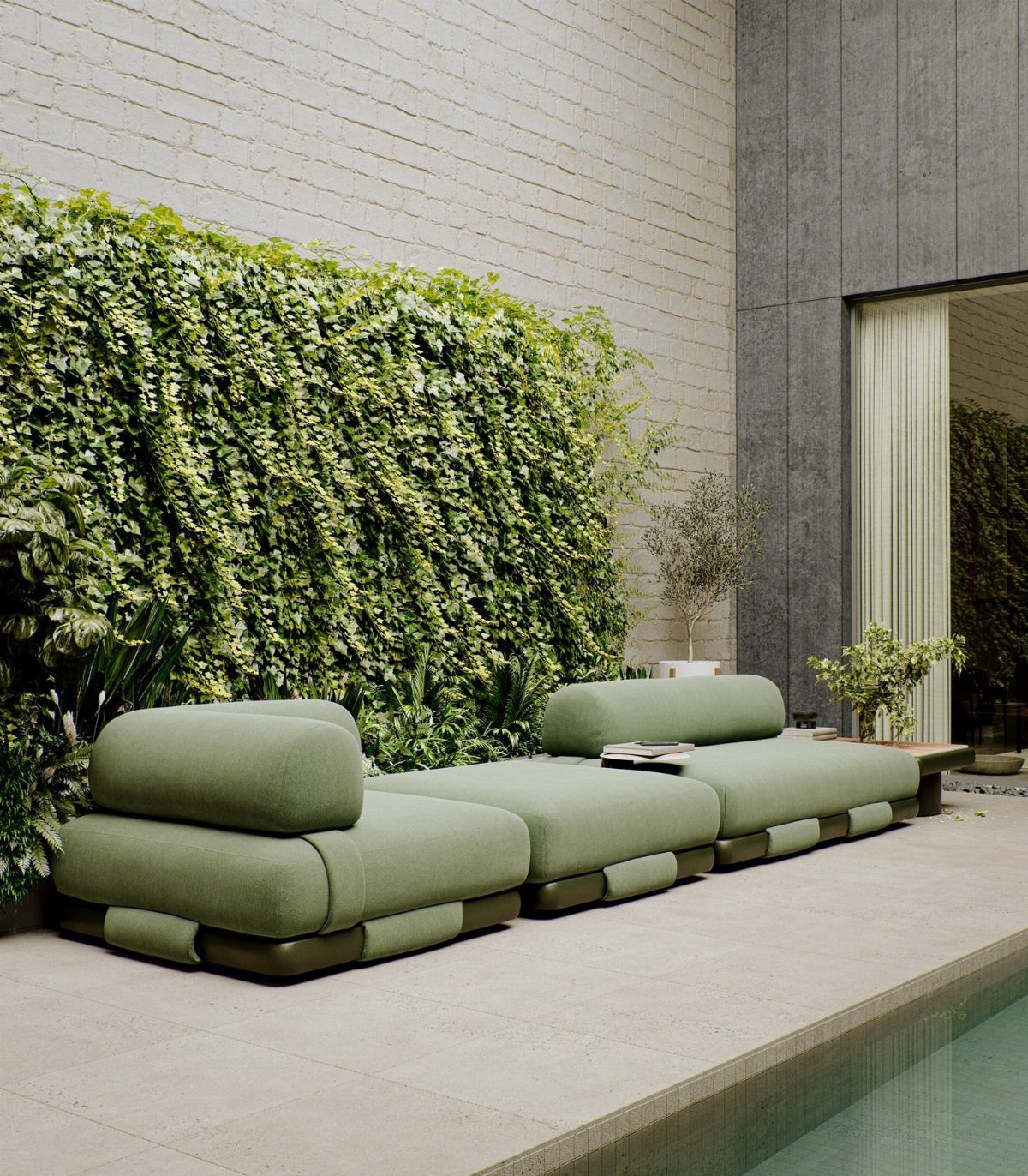29 Scandinavian Outdoor Furniture for Patios and Gardens 18 Sage green modular outdoor sofa on a stone patio by a swimming pool.