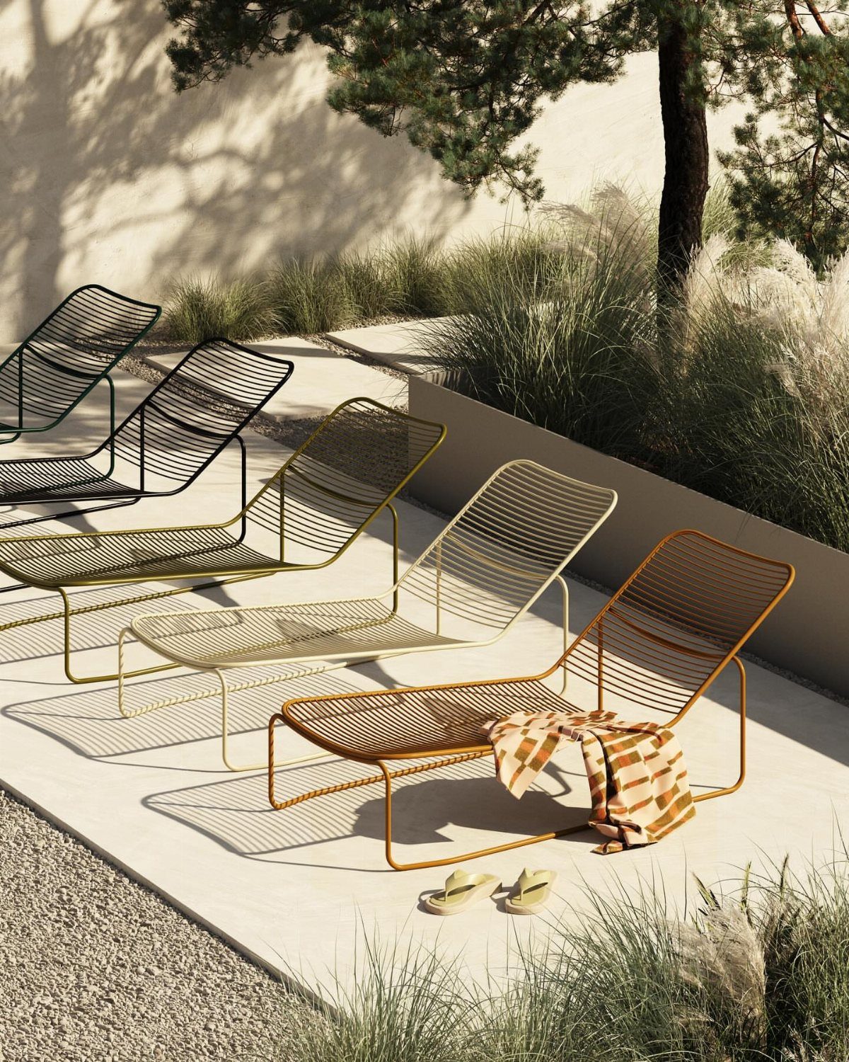 29 Scandinavian Outdoor Furniture for Patios and Gardens 25 Five colorful minimalist wire lounge chairs on a sunny concrete outdoor patio.
