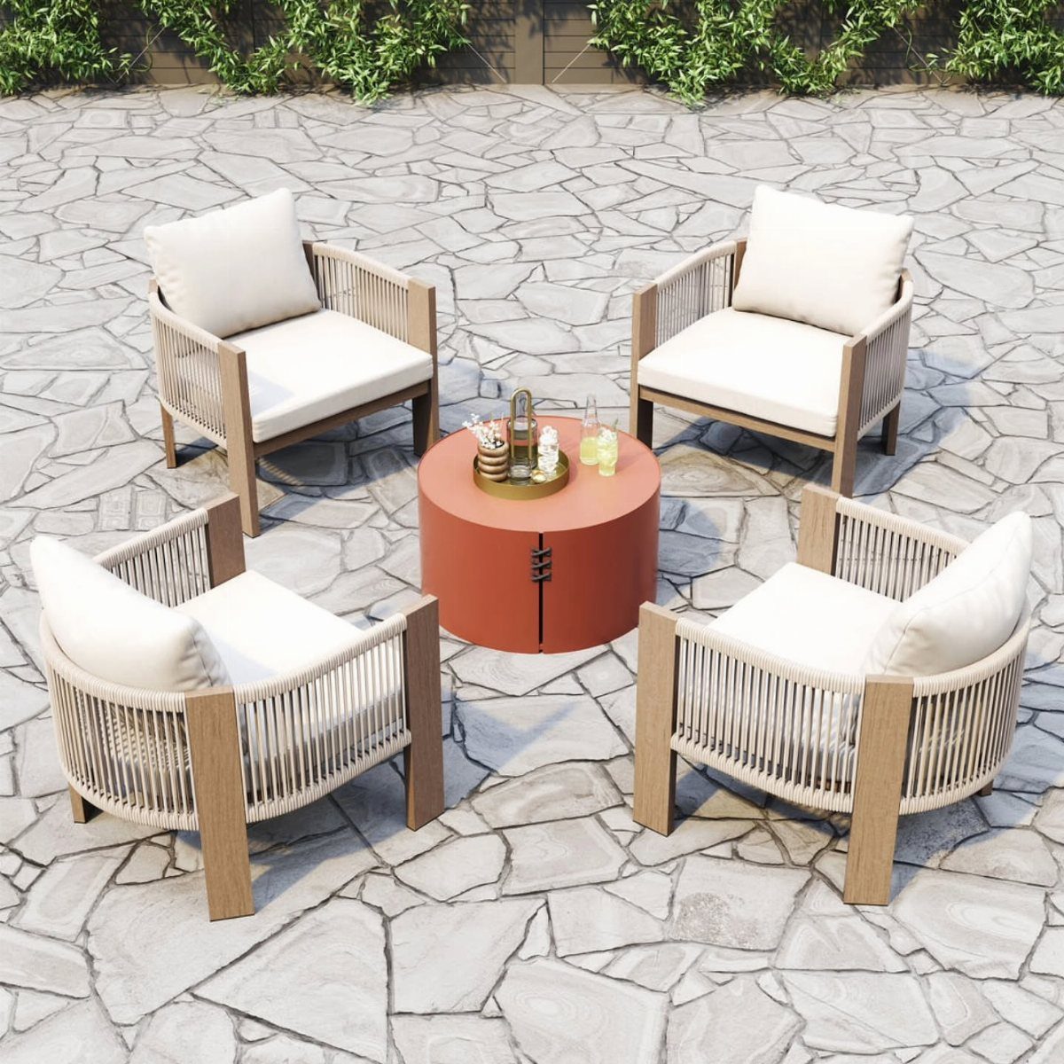 29 Scandinavian Outdoor Furniture for Patios and Gardens 8 Four white rope and wood armchairs surrounding a round orange outdoor coffee table.