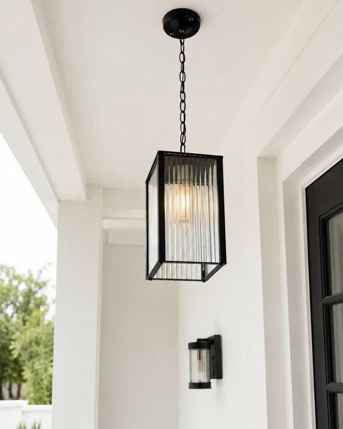 29 Scandinavian Outdoor Furniture for Patios and Gardens 15 Black rectangular pendant light with ribbed glass hanging from a white porch ceiling.