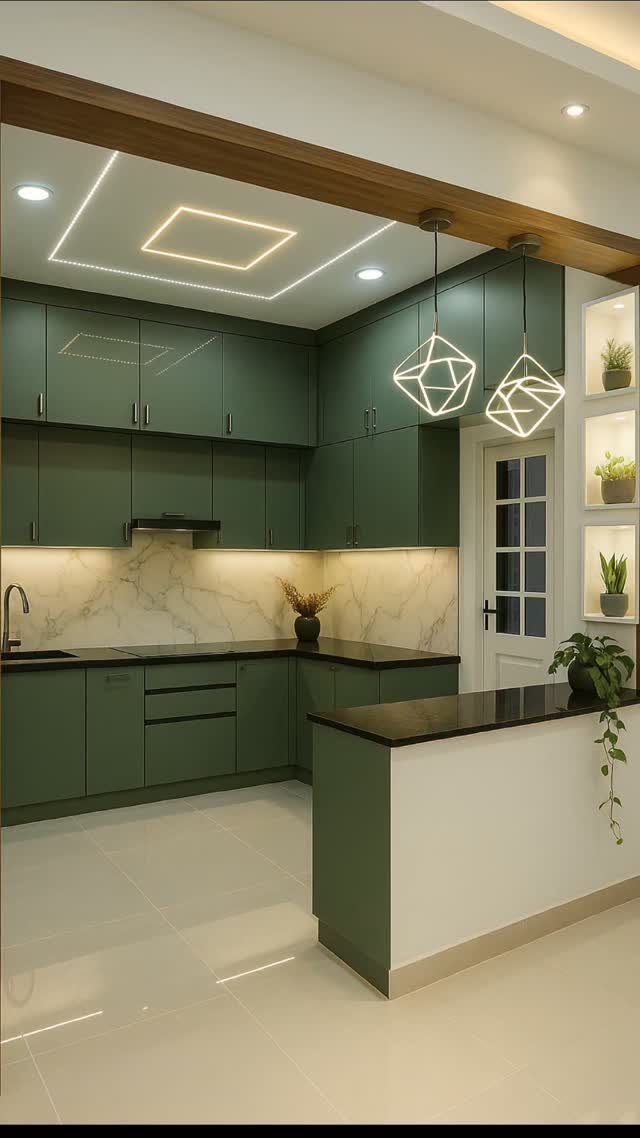 U-shaped kitchen with sage green cabinets and a peninsula opening to another room.