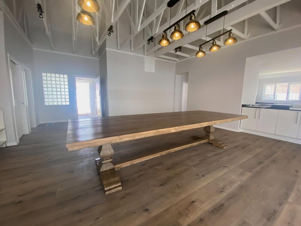 Solid Wood Dining Table Set: 20 Ideas for Your Home 20 Rectangular solid wood dining table with trestle base in a bright modern room.