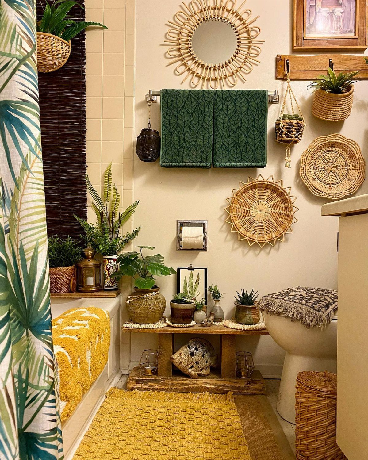 19 Teen Bathroom Ideas That Blend Style and Function 15 Boho-chic bathroom with rattan accessories, green towels, potted plants, and a yellow rug.