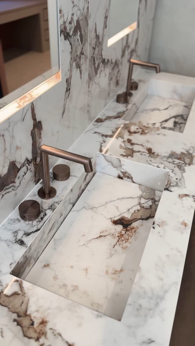19 Teen Bathroom Ideas That Blend Style and Function 19 Double sink vanity with white and brown marble countertop and bronze faucets.